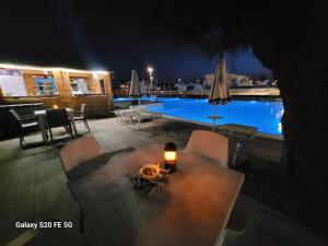 a view of a swimming pool at night at Sunset Village in Marina di Montenero