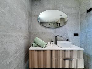 a bathroom with a sink and a mirror at La Suite EDEN - Maison de ville Luxe - 4pers - Jacuzzi - 10min Cannes in Le Cannet