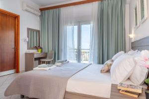 a bedroom with a large bed with a window at House Elena in Koinyra +63 photos