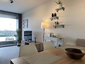 a dining room with a table with a bowl on it at Ferienwohnung Rheinblick in Kehl am Rhein