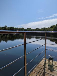 a view of a lake from the deck of a boat at Hausboot Friedrich in Papenburg