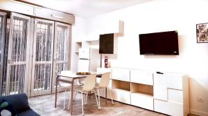 TV a/nebo společenská místnost v ubytování Maison Du Pic - Rho Fiera