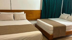 Postelja oz. postelje v sobi nastanitve Hotel Javy