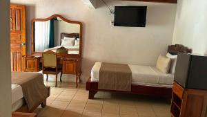 Postelja oz. postelje v sobi nastanitve Hotel Javy