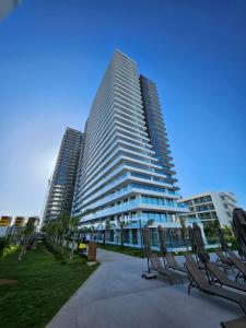 a tall building with chairs in front of it at Grand Sapphire Casino 12 in Iskele +124 photos
