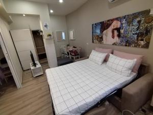 מיטה או מיטות בחדר ב-Casa Sorelle Marchisio