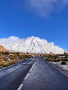a road in the middle of a snowy mountain at Mi Rincón Favorito in Adeje +6 photos