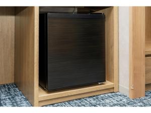 a black tv in a wooden cabinet at Soma Station Hotel - Vacation STAY 40258v in Soma