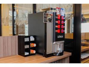 a coffee machine on top of a counter at Soma Station Hotel - Vacation STAY 40262v in Soma