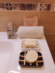 a white counter with plates and towels on it at Intrecci & Impasti in Naples +59 photos