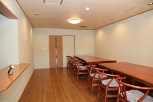 a dining room with wooden tables and chairs at Shikinoyado Murakami - Vacation STAY 43691v 