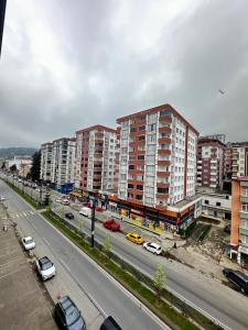 a city with buildings and cars on a highway at Renaissance Apart Hotel in Trabzon