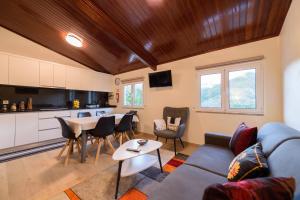 a living room with a couch and a table at CASA RIGOR in Rio Caldo