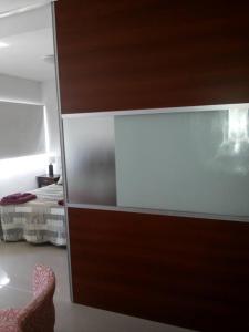 a room with a sliding glass door with a bed at San Isidro in Viedma +4 photos