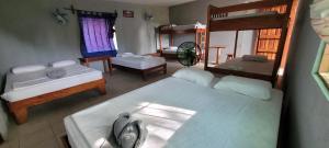 an overhead view of a bedroom with two beds at Hostal Xilotl in San José del Sur