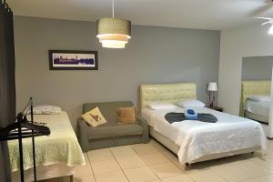 Postel nebo postele na pokoji v ubytování VA Apart Hotel Savassi