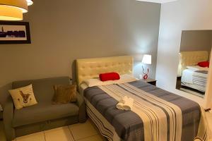 Postel nebo postele na pokoji v ubytování VA Apart Hotel Savassi