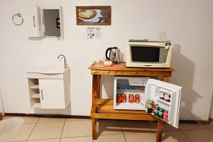 Kuchyň nebo kuchyňský kout v ubytování VA Apart Hotel Savassi