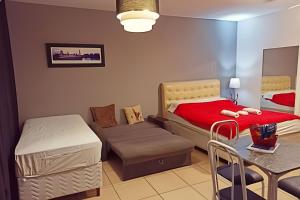 Postel nebo postele na pokoji v ubytování VA Apart Hotel Savassi