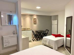 Postel nebo postele na pokoji v ubytování VA Apart Hotel Savassi