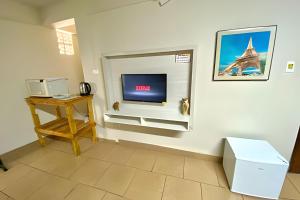 TV a/nebo společenská místnost v ubytování VA Apart Hotel Savassi