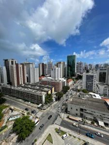 an aerial view of a city with buildings and a street at Flat beach Class conselheiro Aguiar in Recife
