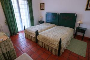 Ένα ή περισσότερα κρεβάτια σε δωμάτιο στο Quinta Centieira Scalab Wine +12 φωτογραφίες