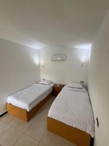 Postel nebo postele na pokoji v ubytování DownTown Hotel