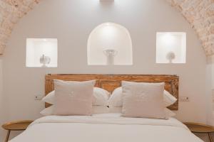 Dimore Bianche lImmacolata客房内的一张或多张床位