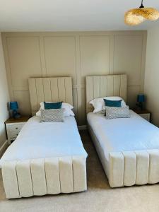 Ένα ή περισσότερα κρεβάτια σε δωμάτιο στο Chic seaside apartment