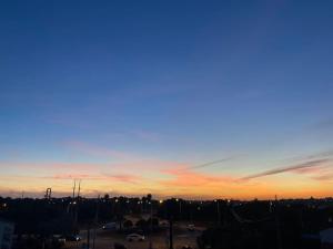 a view of a city at sunset at Stela ' s Guest House in Loulé