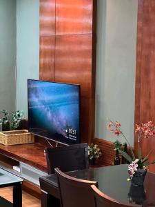 a flat screen tv sitting on top of a table at Parkview KLCC ITSKAYA 11 in Kuala Lumpur
