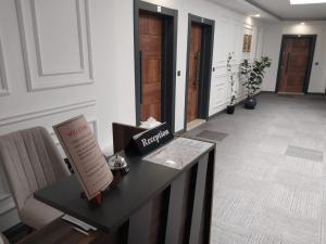 a room with a table with a sign on it at Royal Homes 401 in Antalya