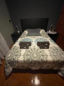 En eller flere senge i et værelse på Departamentos PRANA C con COCHERA