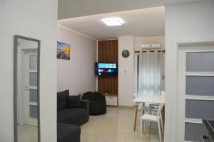 a living room with a couch and a table at Sea Apartment Golem in Golem