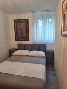 Postel nebo postele na pokoji v ubytování Apartments Slavomir