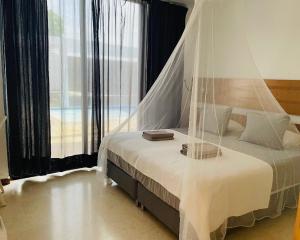 A bed or beds in a room at Casa Paloma with heated pool in El Roque