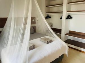 A bed or beds in a room at Casa Paloma with heated pool in El Roque