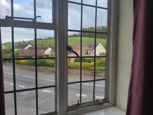 an open window with a view of a street at The Washford Station Inn, in Washford