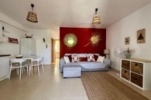 a living room with a couch and a table at Casa Dorada Puerto del Carmen in Puerto del Carmen