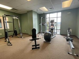 a gym with several exercise equipment in a room at Noelle's Nest Condominium in Pigeon Forge
