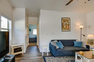 a living room with a couch and a table at Lakefront Pagosa Springs Escape Near Hiking Trails in Pagosa Springs