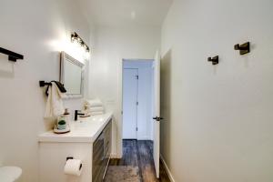 a white bathroom with a sink and a mirror at Lakefront Pagosa Springs Escape Near Hiking Trails in Pagosa Springs +16 photos