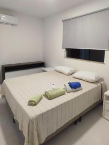 Ένα ή περισσότερα κρεβάτια σε δωμάτιο στο Village Novo Barra do Jacuípe