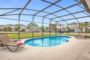 a swimming pool with a pergola and chairs at Upstay - Sonoma Resort Home w Private Pool in Kissimmee