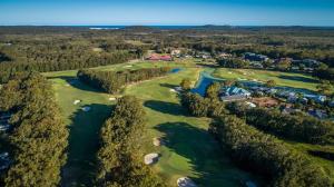 an aerial view of the golf course at the resort at Hitters Paradise - Stay & Play in Salamander Bay in Salamander Bay