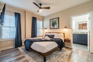 a bedroom with a bed and a ceiling fan at The Roosted Retreat in Tampa