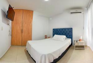 Ένα ή περισσότερα κρεβάτια σε δωμάτιο στο HOTEL EBENEZER