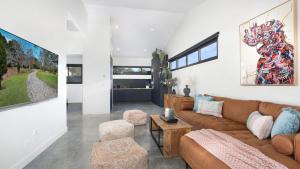 a living room with a couch and a table at Blackwood Manor Retreat in Braemar