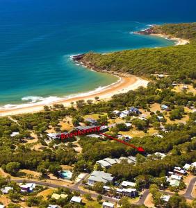 an aerial view of a beach and the ocean at Breakaway - Resort-style studio in Agnes Water in Agnes Water